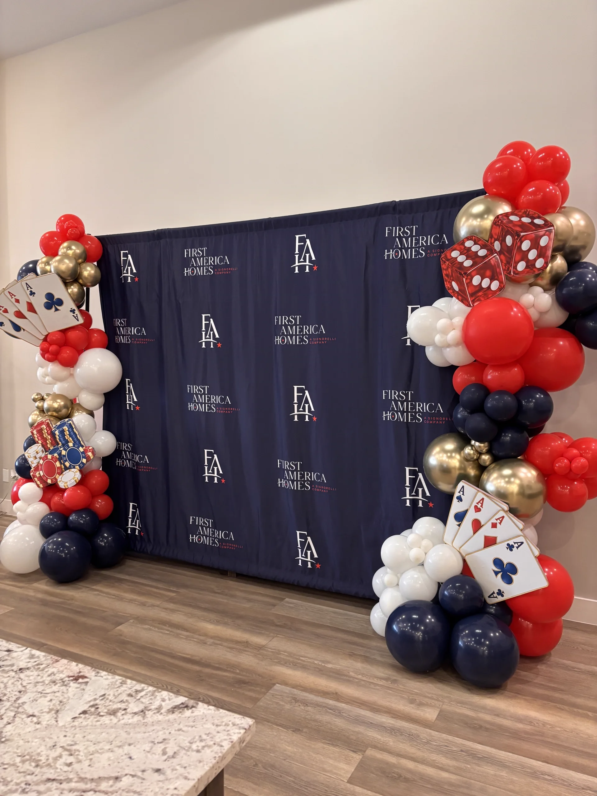Corporate grand opening balloon installation with brand colors